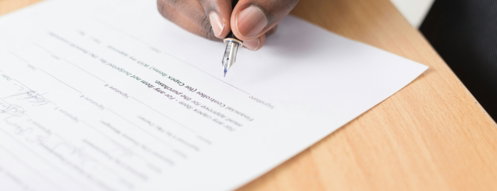 person-writing-on-white-paper.jpg person writing on white paper