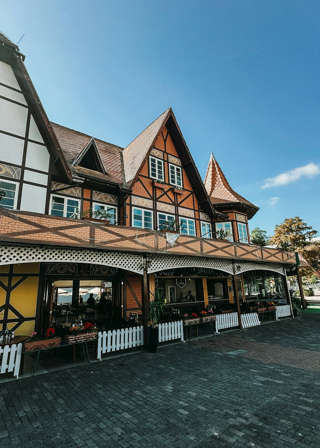 European-style building with timber framing and red roof.